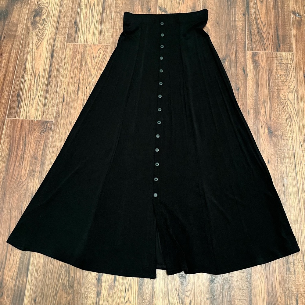 WOMENS Black polyester/spandex stretch long skirt. Length 35” inches